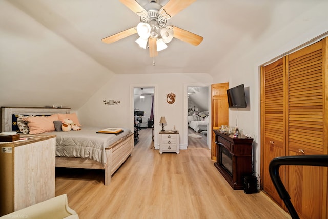 4619 N Springfield Ave, Chicago, IL 60625 - bedroom with light wood-style flooring, a closet, lofted ceiling, and ceiling fan