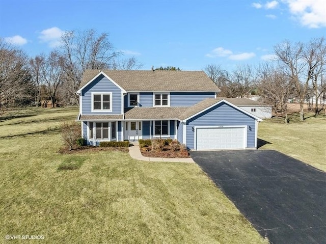 35491 N Kenneth Dr, Lake Villa, IL 60046 - traditional-style house with an attached garage, asphalt driveway, covered porch, a front yard, and a shingled roof