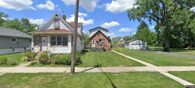 bungalow featuring a detached garage, a front lawn, and a chimney