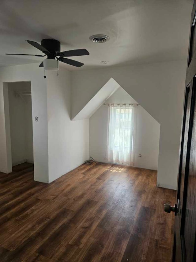 additional living space featuring wood finished floors and a ceiling fan