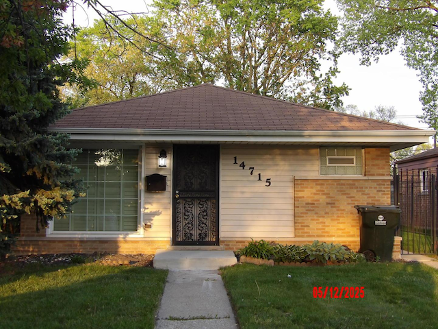 14715 Kenwood Ave, Dolton, IL 60419 - single story home with a front lawn and brick siding