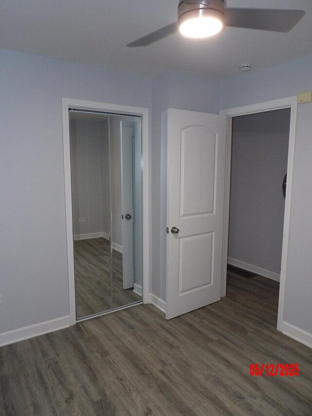 14715 Kenwood Ave, Dolton, IL 60419 - unfurnished bedroom featuring wood finished floors, baseboards, a closet, and a ceiling fan