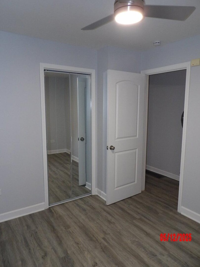 14715 Kenwood Ave, Dolton, IL 60419 - unfurnished bedroom featuring wood finished floors, baseboards, a closet, and ceiling fan