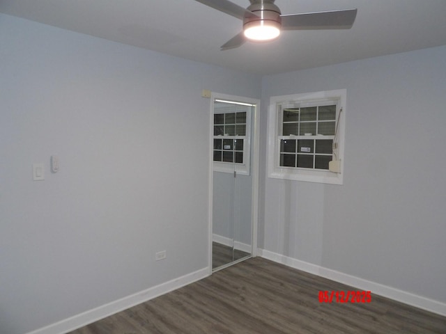 14715 Kenwood Ave, Dolton, IL 60419 - spare room with dark wood-style flooring, ceiling fan, and baseboards