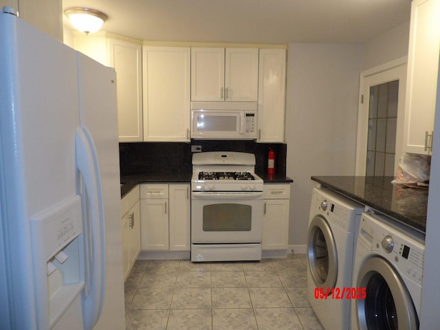 14715 Kenwood Ave, Dolton, IL 60419 - kitchen featuring white appliances, separate washer and dryer, white cabinetry, and dark stone countertops