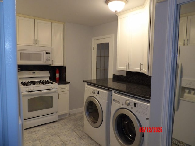 14715 Kenwood Ave, Dolton, IL 60419 - laundry room with washer and clothes dryer, light tile patterned flooring, and baseboards