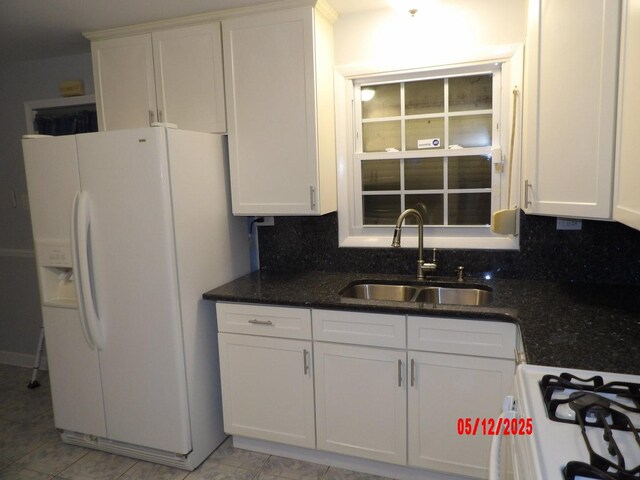 14715 Kenwood Ave, Dolton, IL 60419 - kitchen featuring a sink, white appliances, white cabinets, and dark stone countertops