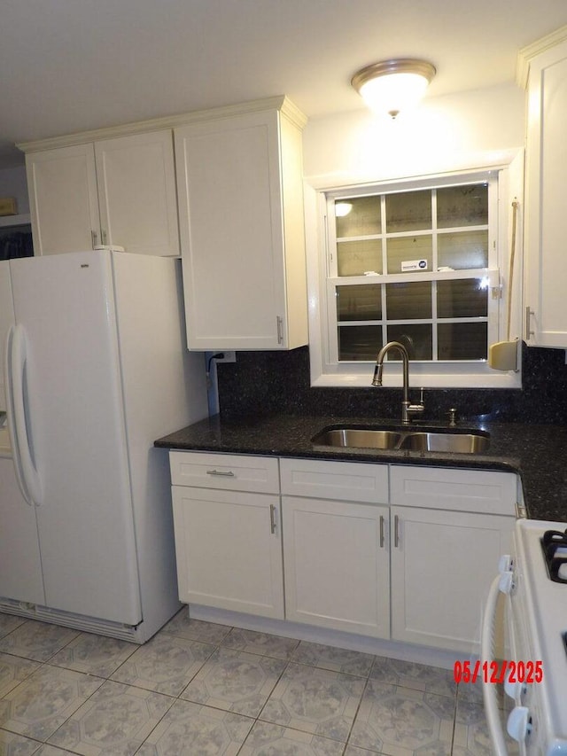 14715 Kenwood Ave, Dolton, IL 60419 - kitchen featuring a sink, white fridge with ice dispenser, gas stove, and white cabinets