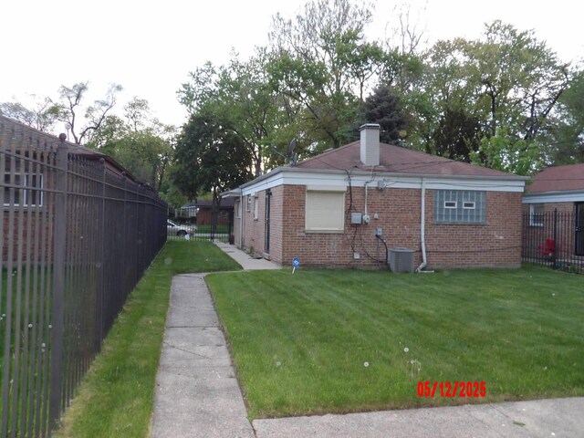 14715 Kenwood Ave, Dolton, IL 60419 - view of property exterior with brick siding and a chimney