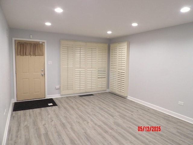 14715 Kenwood Ave, Dolton, IL 60419 - spare room featuring recessed lighting, baseboards, and wood finished floors