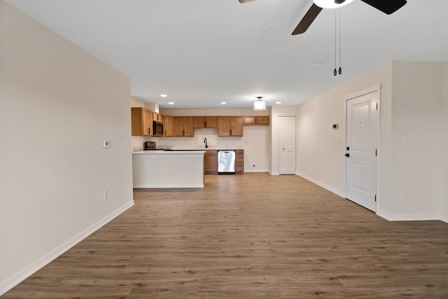 2034 W 75th Pl Unit 35, Merrillville, IN 46410 - unfurnished living room with baseboards, recessed lighting, light wood-style floors, and a ceiling fan