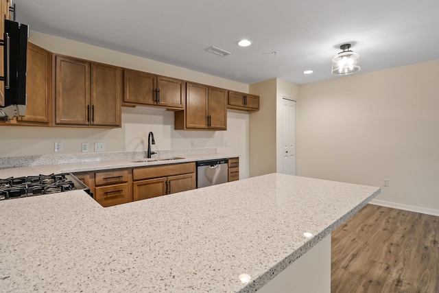 2034 W 75th Pl Unit 35, Merrillville, IN 46410 - kitchen with a sink, dishwasher, wood finished floors, recessed lighting, and a peninsula