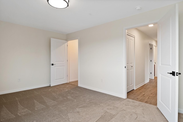 2034 W 75th Pl Unit 35, Merrillville, IN 46410 - carpeted empty room featuring a smoke detector and baseboards
