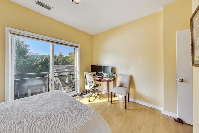 1133 N Wood St Unit 3S, Chicago, IL 60622 - bedroom featuring access to exterior, light wood finished floors, and baseboards
