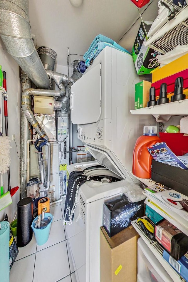 1133 N Wood St Unit 3S, Chicago, IL 60622 - laundry area with stacked washer / drying machine and tile patterned flooring
