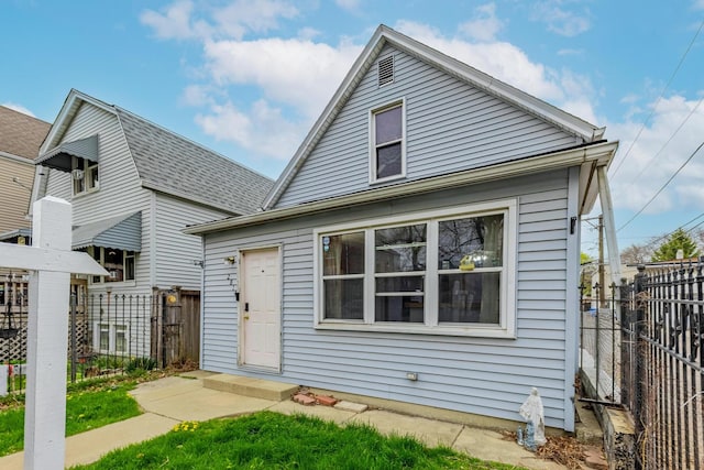 2814 W 40th St, Chicago, IL 60632 - bungalow-style home featuring fence and a shingled roof