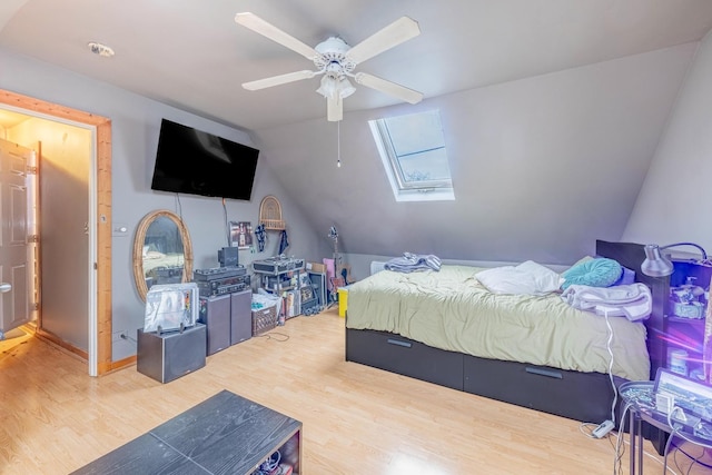 2814 W 40th St, Chicago, IL 60632 - bedroom featuring wood finished floors, a skylight, vaulted ceiling, and a ceiling fan