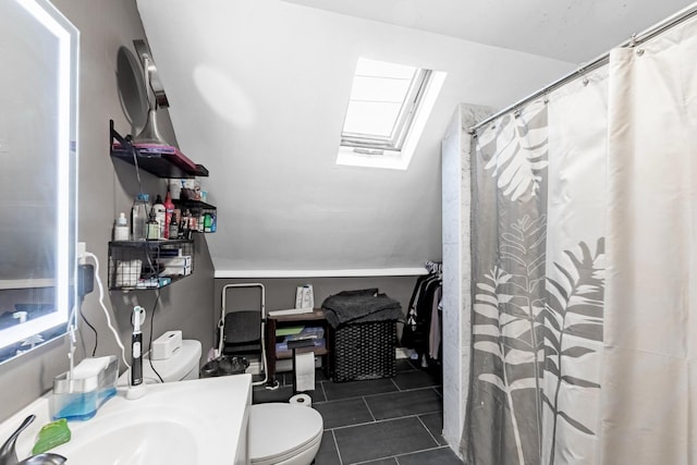 2814 W 40th St, Chicago, IL 60632 - bathroom with a skylight, tile patterned flooring, toilet, vanity, and curtained shower