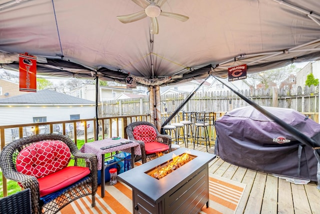 2814 W 40th St, Chicago, IL 60632 - wooden deck with an outdoor fire pit, fence, area for grilling, and a ceiling fan