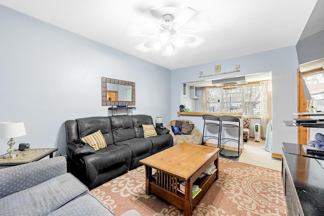 2814 W 40th St, Chicago, IL 60632 - living room with light wood-style floors, a ceiling fan, and a chandelier