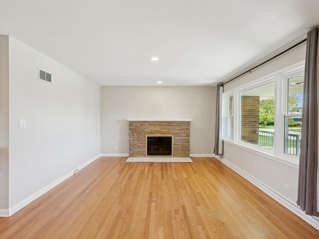 6502 Palma Ln, Morton Grove, IL 60053 - unfurnished living room with light wood-style floors, a fireplace, baseboards, and recessed lighting