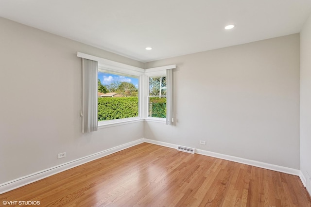 6502 Palma Ln, Morton Grove, IL 60053 - spare room with baseboards, light wood-style flooring, and recessed lighting