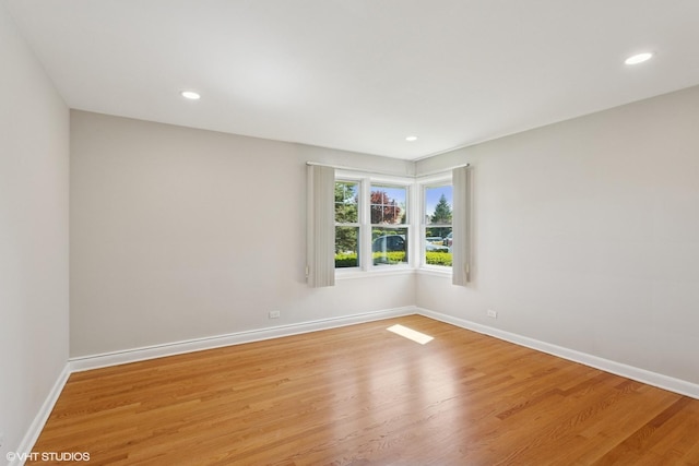 6502 Palma Ln, Morton Grove, IL 60053 - empty room featuring light wood-type flooring, baseboards, and recessed lighting