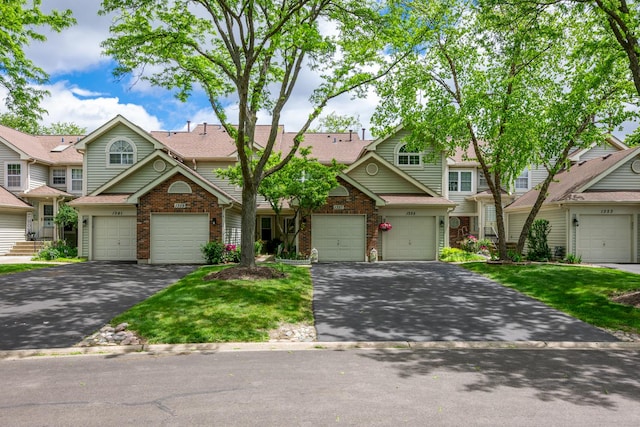 1357 Coldspring Rd, Carol Stream, IL 60188 - view of property with driveway, brick siding, roof with shingles, and a front yard