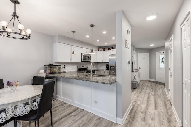 1357 Coldspring Rd, Carol Stream, IL 60188 - kitchen featuring stainless steel appliances, a sink, light wood finished floors, tasteful backsplash, and recessed lighting