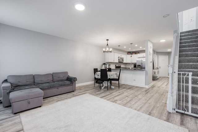 1357 Coldspring Rd, Carol Stream, IL 60188 - living area with stairs, light wood-style floors, baseboards, a chandelier, and recessed lighting