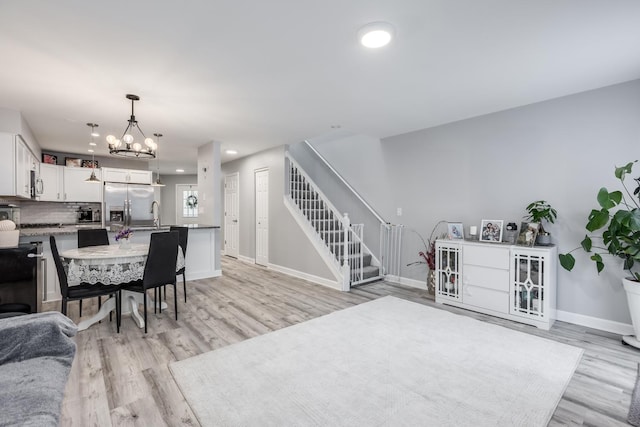 1357 Coldspring Rd, Carol Stream, IL 60188 - dining space featuring a chandelier, light wood finished floors, baseboards, and recessed lighting
