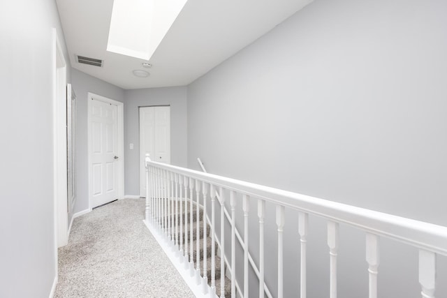 1357 Coldspring Rd, Carol Stream, IL 60188 - hall with a skylight, an upstairs landing, carpet, and baseboards