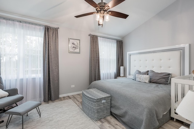 1357 Coldspring Rd, Carol Stream, IL 60188 - bedroom with light wood-style floors, vaulted ceiling, a ceiling fan, and baseboards