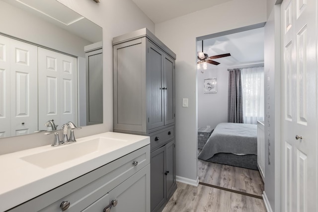 1357 Coldspring Rd, Carol Stream, IL 60188 - bathroom with a ceiling fan, vanity, wood finished floors, and baseboards