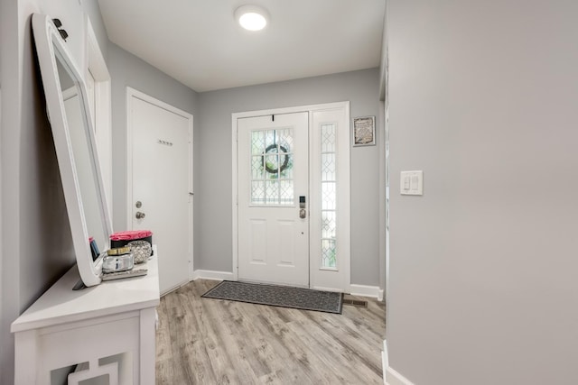 1357 Coldspring Rd, Carol Stream, IL 60188 - foyer entrance with baseboards and light wood finished floors