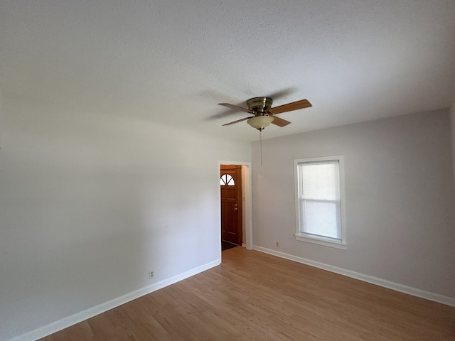 650 Enterprise St, Elgin, IL 60120 - spare room with ceiling fan, wood finished floors, and baseboards