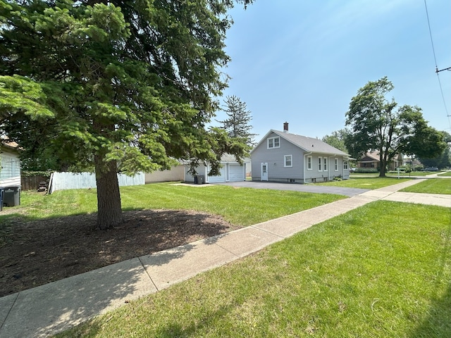 650 Enterprise St, Elgin, IL 60120 - view of front facade with driveway and a chimney