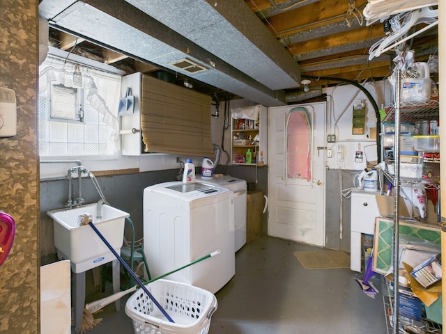 11314 S Green Bay Ave, Chicago, IL 60617 - below grade area featuring washing machine and clothes dryer and a sink