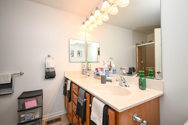 39735 N Paris Dr, Beach Park, IL 60083 - full bath featuring a shower with shower door, double vanity, and baseboards