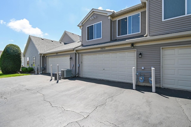 39735 N Paris Dr, Beach Park, IL 60083 - garage featuring central AC unit and asphalt driveway