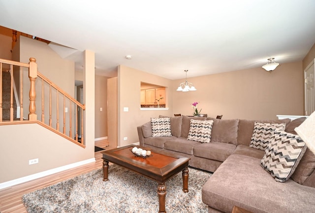 39735 N Paris Dr, Beach Park, IL 60083 - living room with wood finished floors, stairs, a chandelier, and baseboards