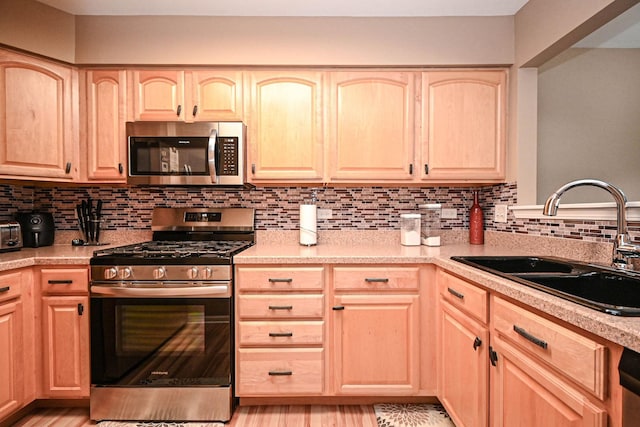 39735 N Paris Dr, Beach Park, IL 60083 - kitchen with appliances with stainless steel finishes, light brown cabinets, and a sink