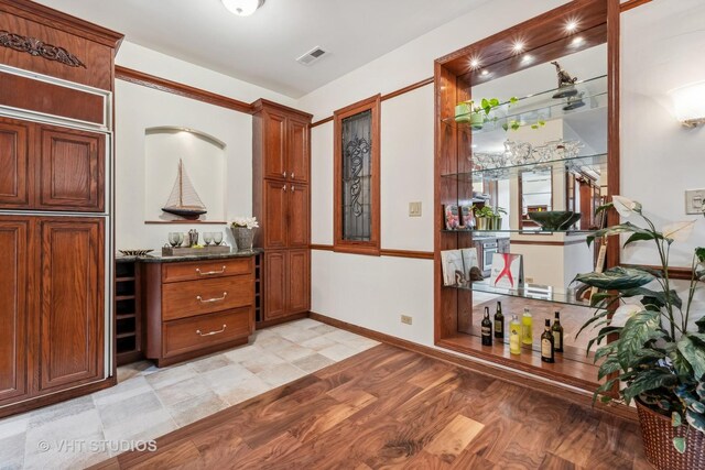 818 N Dearborn St Unit 1R, Chicago, IL 60610 - bar area with light wood-style flooring and baseboards