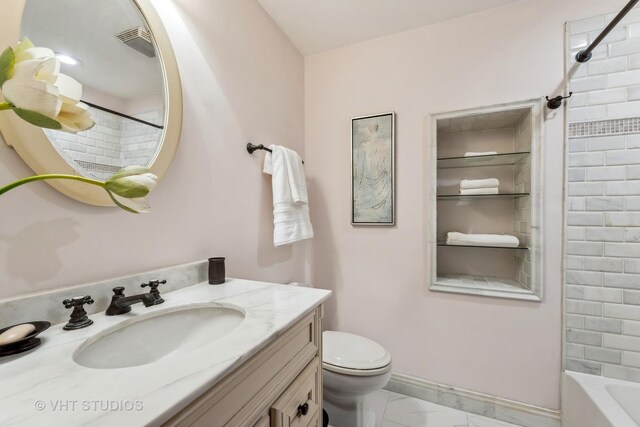 818 N Dearborn St Unit 1R, Chicago, IL 60610 - full bath featuring marble look tiles, toilet, vanity, baseboards, and shower / washtub combination