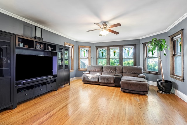 5945 W Dakin St, Chicago, IL 60634 - living area featuring healthy amount of natural light, light wood finished floors, a ceiling fan, baseboards, and crown molding