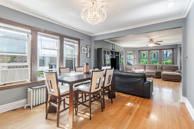 5945 W Dakin St, Chicago, IL 60634 - dining space featuring radiator, baseboards, healthy amount of natural light, and crown molding