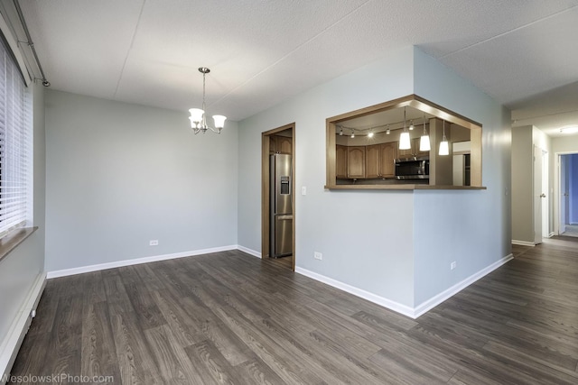 9737 N Fox Glen Dr Unit 4A, Niles, IL 60714 - unfurnished living room with dark wood-type flooring, track lighting, baseboards, and a chandelier