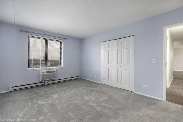 9737 N Fox Glen Dr Unit 4A, Niles, IL 60714 - unfurnished bedroom with a baseboard radiator, baseboards, carpet, and a closet