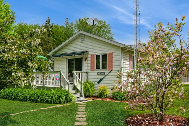 26477 Springwell St, Antioch, IL 60002 - view of front facade featuring a deck and a front yard