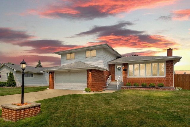 851 Munroe Cir, Des Plaines, IL 60016 - tri-level home featuring a chimney, concrete driveway, brick siding, and an attached garage